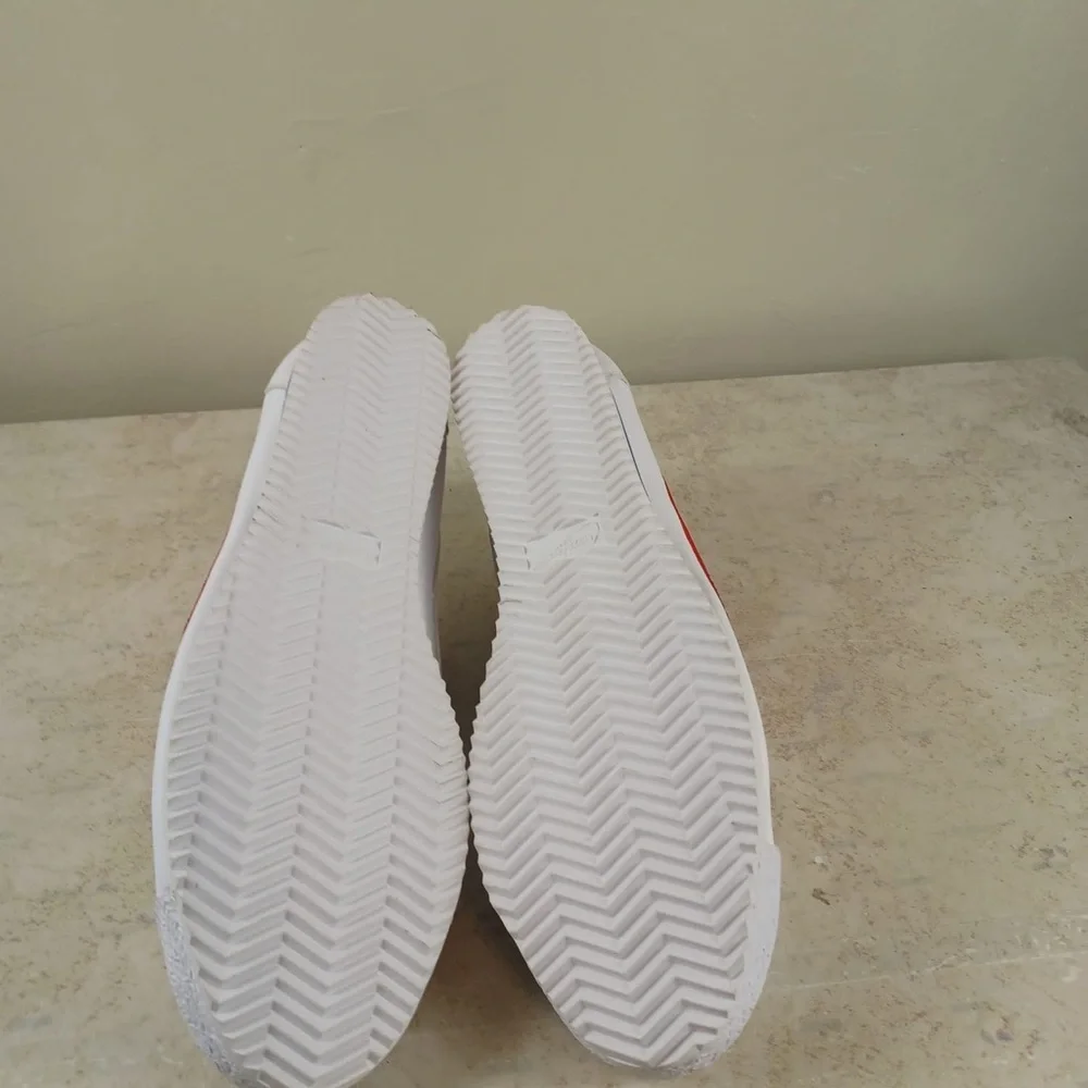 Nike White Sneakers with Red Swoosh and Blue Outsole Trim